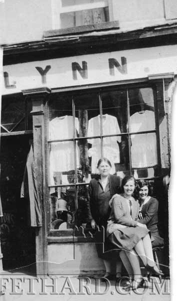 Three ladies outside O'Flynn's Drapery shop window (possible where O'Flynn's Menshop was situated in Burke Street)